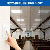 Hand adjusting a light switch in a church with dimmable lighting 0-10V text at the top.