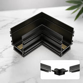 Black 90-degree L-shaped corner connector for 4-wire 24V recessed magnetic track lighting, constructed from durable aluminum alloy for seamless flush-mount track installations.