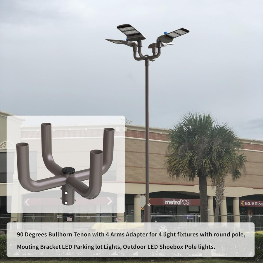 Outdoor LED shoebox pole lights with a mounting bracket in front of a building.