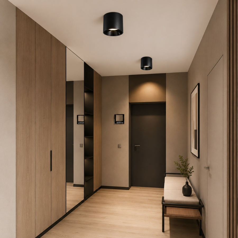 Modern hallway with wooden paneling, black fixtures, and a bench with a plant.