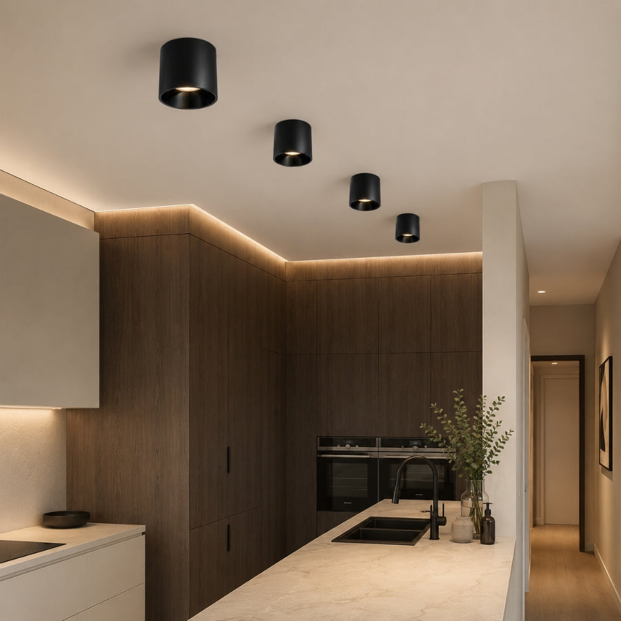 Modern kitchen interior with wooden cabinets, black fixtures, and a neutral color palette.
