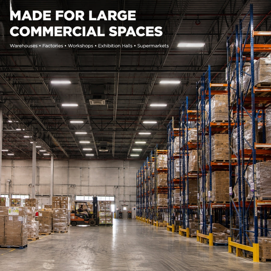 A wide view of a large warehouse interior with tall blue and orange pallet racks filled with boxes, a concrete floor, overhead fluorescent lighting, and text at the top reading 'MADE FOR LARGE COMMERCIAL SPACES' with smaller text listing warehouses, factories, workshops, exhibition halls, and supermarkets.