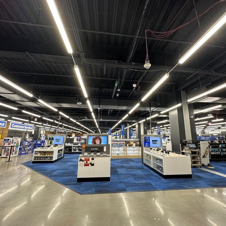 Large retail store interior with various displays and lighting fixtures.