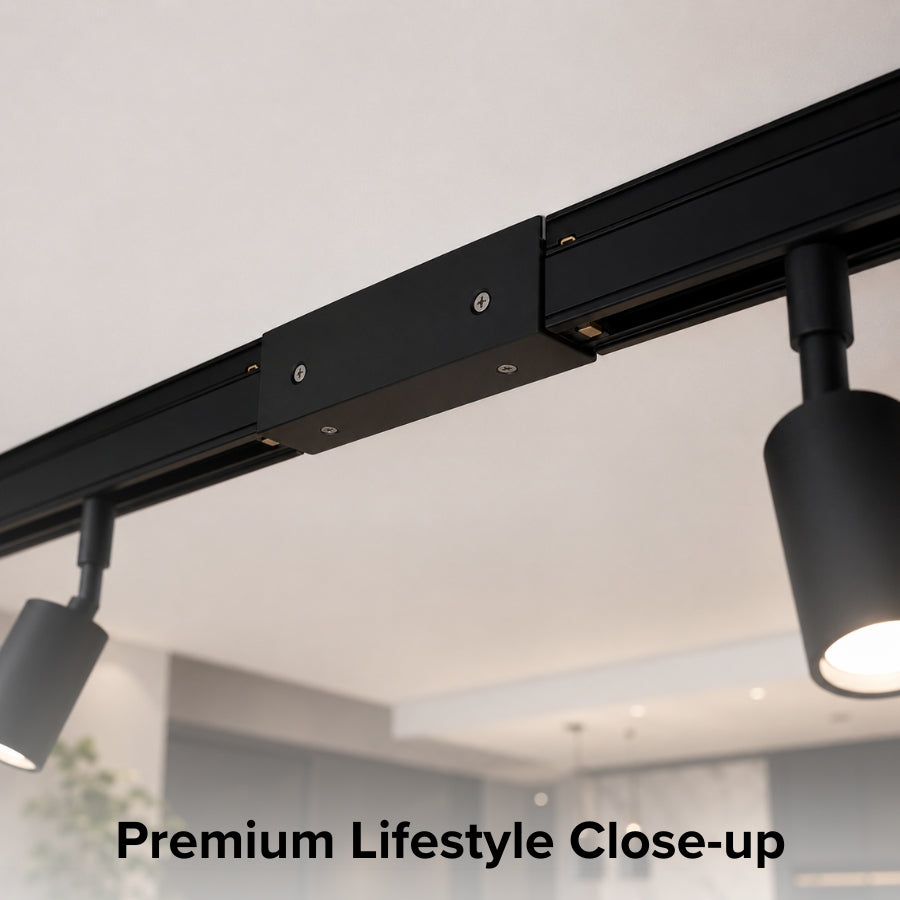 Detailed close-up of a black inline center power feed connector installed on a single circuit track lighting system, highlighting its sleek design, secure electrical connection, and premium black finish.