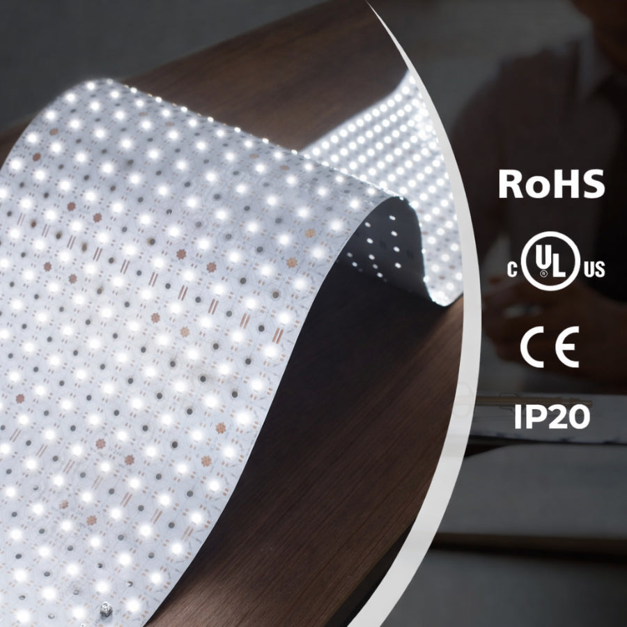 Close-up of a roll ofsheet lights led​ with certification logos on a dark background