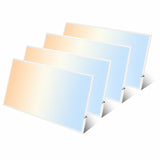 Four 2x4 LED flat panel lights arranged in an angled layout, showing slim profile design, even light diffusion, and suitability for commercial drop ceiling installations.