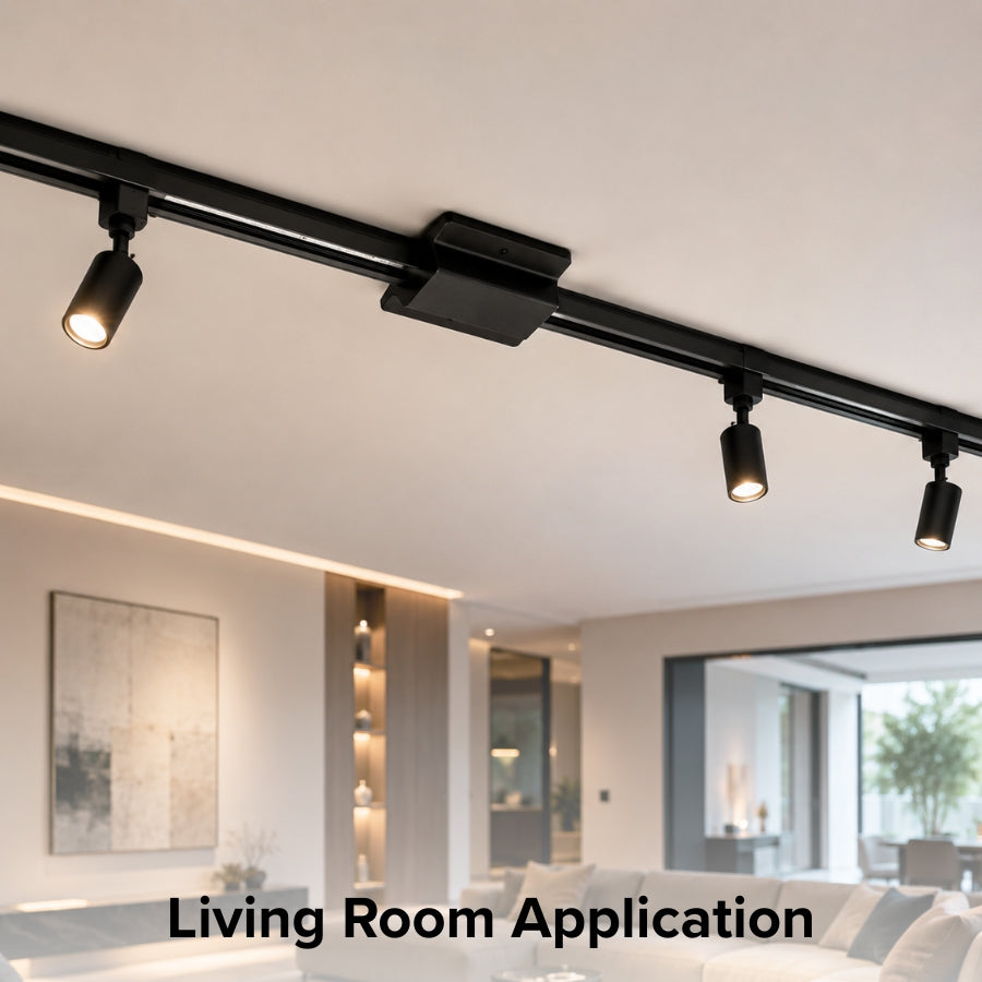 Modern living room featuring black single circuit track lighting powered by a floating canopy feed, providing seamless ceiling-mounted illumination for contemporary residential interiors.