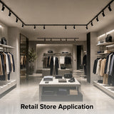Modern retail clothing store illuminated with a black single circuit track lighting system using an inline center power feed connector for seamless lighting distribution and professional product displays.