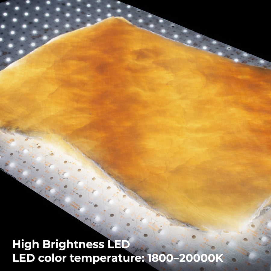 Rectangular LED light panel with a warm yellow glow on a perforated metal surface.