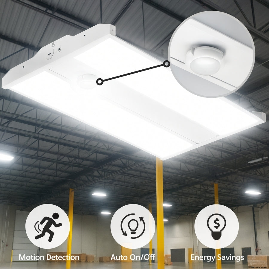 Ceiling-mounted LED light fixture with motion detection sensor in a warehouse setting