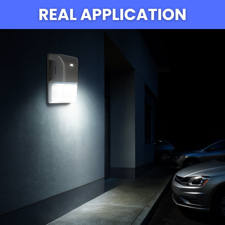 Wall-mounted security light illuminating a dark alleyway with parked cars. wall packs 20w